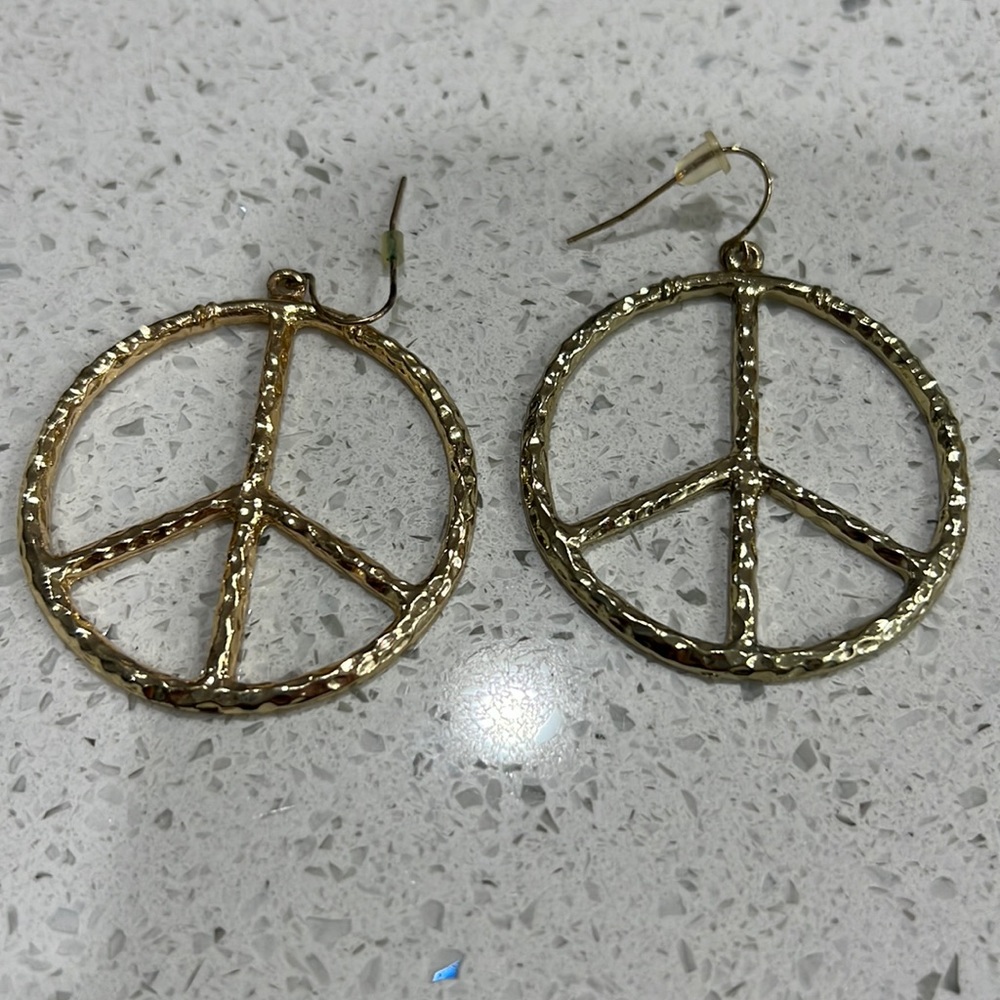 Gold peace sign earrings
